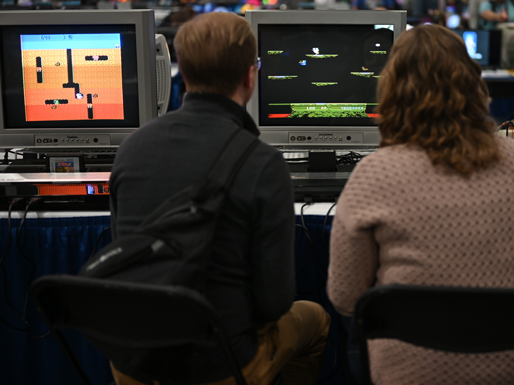 A couple playing console games